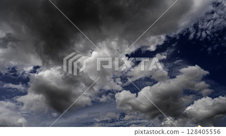 Dramatic dark storm rain clouds black sky background. Dark thunderstorm clouds rainny atmosphere. Meteorology danger windstorm disasters climate. Dark cloudscape storm disaster gloomy gray cloud sky Dramatic dark storm rain clouds black sky background. Dark thunderstorm clouds rainny atmosphere. Meteorology danger windstorm disasters climate. Dark cloudscape storm disaster gloomy gray cloud sky 128405556