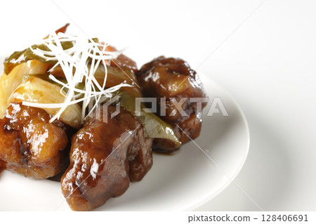 Sweet and sour pork with black vinegar photographed on white background Sweet and sour pork with black vinegar photographed on white background 128406691