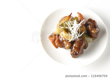 Sweet and sour pork with black vinegar photographed on white background 128406709