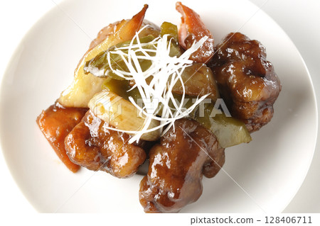 Sweet and sour pork with black vinegar photographed on white background 128406711