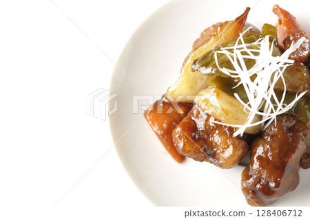 Sweet and sour pork with black vinegar photographed on white background 128406712