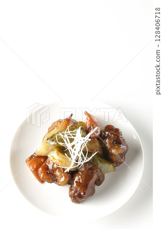 Sweet and sour pork with black vinegar photographed on white background Sweet and sour pork with black vinegar photographed on white background 128406718