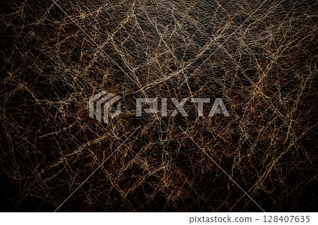 Rich leather texture with worn patches and creases 128407635