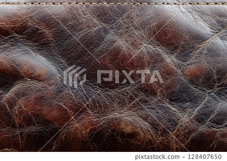 Rich leather texture with worn patches and creases Rich leather texture with worn patches and creases 128407650