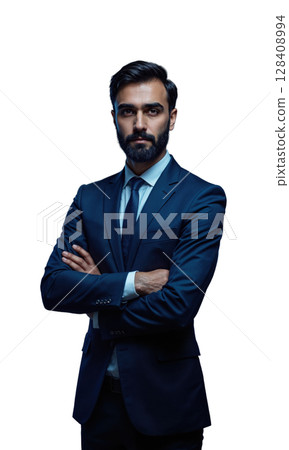 A South Asian male executive in a tailored navy suit, standing with arms crossed as glowing projections of international business 128408994