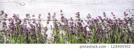Lavender flowers lie on the table Lavender flowers lie on the table 128409302