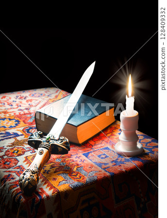 Iron sword on old bible 128409332