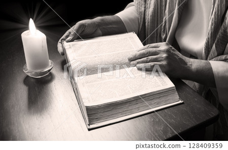 Man reading an old bible Man reading an old bible 128409359