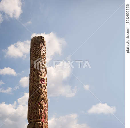Old wooden idol in the field Old wooden idol in the field 128409366