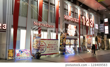 Pachinko store in Kumamoto. Pachinko is a type of mechanical game originating in Japan and is used as a gambling Pachinko store in Kumamoto. Pachinko is a type of mechanical game originating in Japan and is used as a gambling 128409563