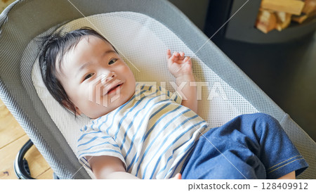Baby sleeping in a cradle Baby sleeping in a cradle 128409912