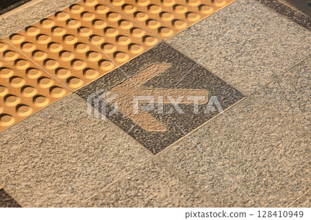 Platform sign on the floor at train Station, For in and out pathway of passengers. 128410949
