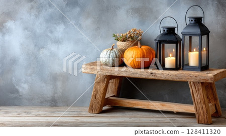 Candles flicker beside carved pumpkins on a rustic table, setting a mysterious mood perfect for Halloween celebrations and decorations 128411320