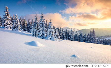 White frosty trees and snowy mountains under a blue sky create a beautiful winter landscape 128411826