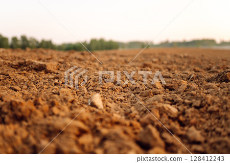 Black earth for plant background. Close-up of black soil prepared before sowing plants. Black earth for plant background. Close-up of black soil prepared before sowing plants. 128412243