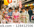 Female college student in yukata enjoying a hot spring trip 128412506