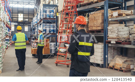 Warehouse management logistics team counting checking products on inventory shelf. Hispanic men worker check stock control in distribution storage. Teamwork shipment worker checklist quality control Warehouse management logistics team counting checking products on inventory shelf. Hispanic men worker check stock control in distribution storage. Teamwork shipment worker checklist quality control 128413540
