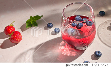 glass of red drink glass of red drink 128413573