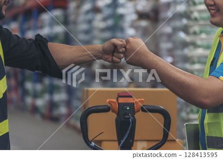 Diversity Teamwork Warehouse worker fist bump together trust partner. Engineer man, women hands partnership. Coworker colleague logistics Warehouse agreement. Multiracial Two people fist bump partner 128413595