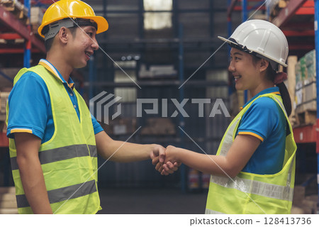 Close up warehouse worker shakehand together. Engineer man hands partnership. Diversity Coworker Men logistics Warehouse teams handshake. Multiracial Support team greeting person teamwork colleagues 128413736