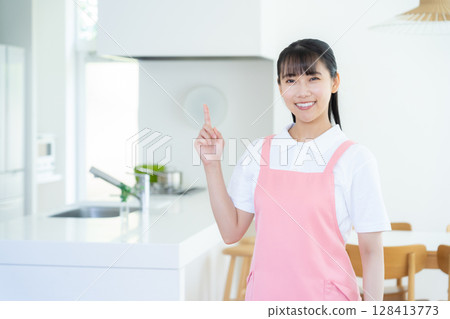 A female caregiver providing home care A female caregiver providing home care 128413773