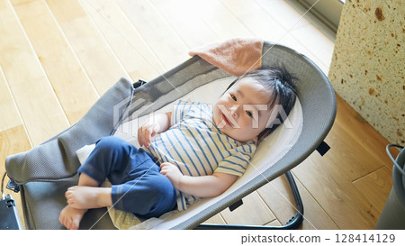 Baby sleeping in a cradle Baby sleeping in a cradle 128414129