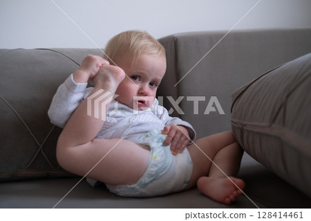 Toddler Touching Ear with Heel While Doing Gymnastics Toddler Touching Ear with Heel While Doing Gymnastics 128414461