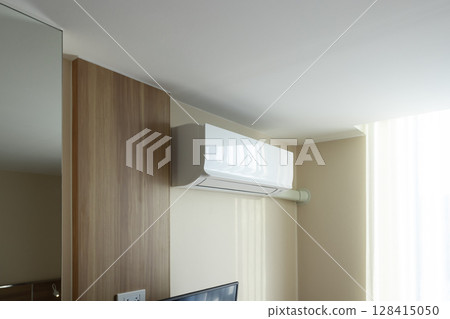 Air conditioner in room for cool climate. 128415050