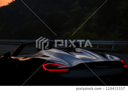 Glossy black open car Glossy black open car 128415337