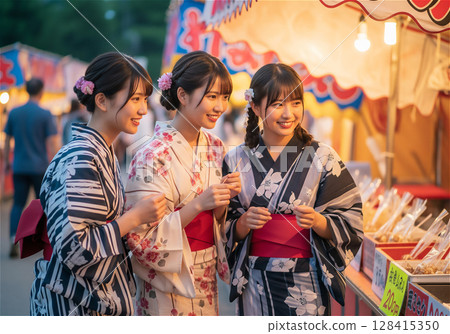 Young women enjoying the festival at the summer festival 128415350