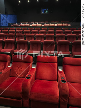 Rows of seats in the cinema for watching a movie Rows of seats in the cinema for watching a movie 128415447