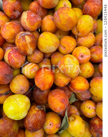 lots of ripe plum fruits for food as background lots of ripe plum fruits for food as background 128415448