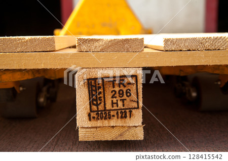 Wood pallet feet used in transport and storage, Located on wooden pallet. Heat treatment. ISPM IPPC 128415542