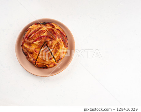 Vegan nectarine peach cake on white table, summer fruit pie 128416029