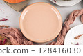 Fall thanksgiving table setting pumpkin decor flatlay with pink dish 128416030