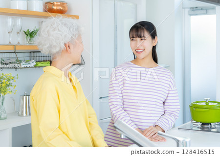 Grandmother and grandson cooking in the kitchen Grandmother and grandson cooking in the kitchen 128416515