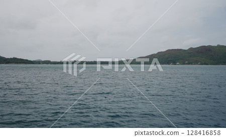 Sailing on a boat around Seychelles island in January Sailing on a boat around Seychelles island in January 128416858