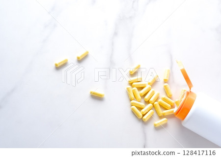 Taking capsule supplements to improve health 128417116