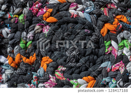 Macro texture of braided recycled fabric rug Macro texture of braided recycled fabric rug 128417188