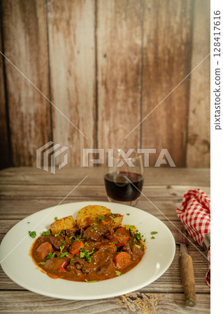 Hearty beef stew with vegetables and wine Hearty beef stew with vegetables and wine 128417616