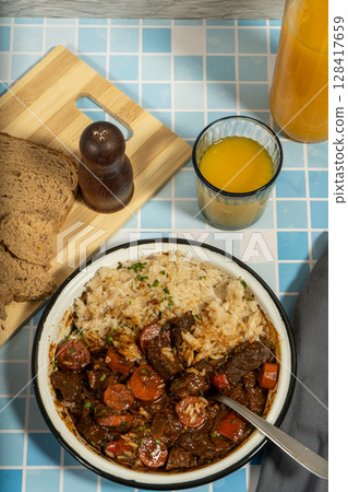 Hearty beef stew with rice and fresh bread Hearty beef stew with rice and fresh bread 128417659