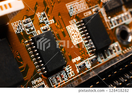 Printed circuit board, close-up. Small microprocessor, microcontroller on the motherboard of a modern desktop PC, macro of an object, close-up, shallow depth of field, nobody 128418282