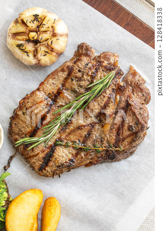 Grilled steak with rosemary garlic and potato Grilled steak with rosemary garlic and potato 128418338