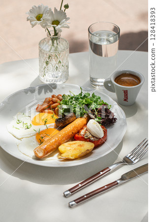 Portion of breakfast with sausage and fried eggs Portion of breakfast with sausage and fried eggs 128418393