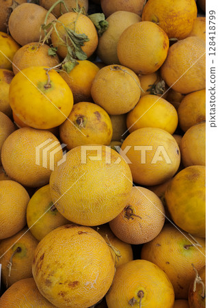 Summer fruits gathered at a local market in the afternoon light 128418799