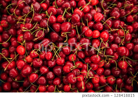 Fresh cherries stacked together at a local market during the summer season Fresh cherries stacked together at a local market during the summer season 128418815