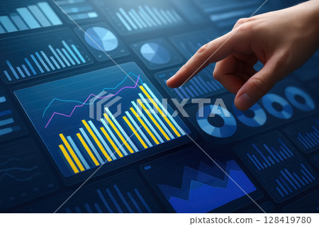 Hand is pointing at a graph on a computer screen 128419780