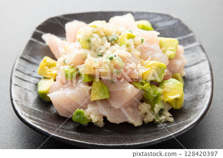 Delicious tuna sashimi and avocado dish 128420397