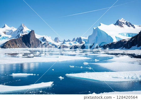 A spectacular landscape of ice blocks and snow-covered mountains 128420564