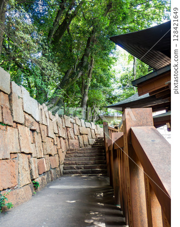 The approach to the shrine is surrounded by greenery and beautiful stonework 128421649